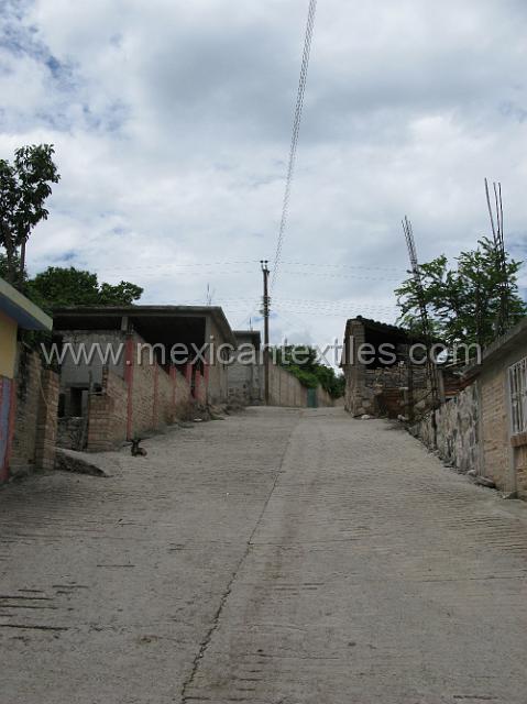 tula del rio07.JPG - Many of the streets were paved and I met a few of the men responsible , who brought me to the home of a woman in traditional costume.